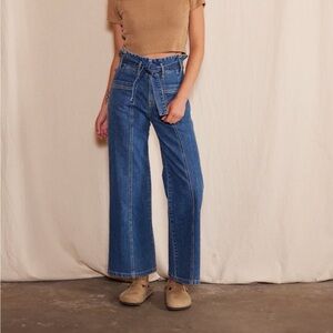 The Penny Paperbag is high-waisted, cinched with pleated gathers, and belted.